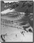 Italian alpine troops sking up a mountain pass
