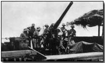 British gun crew on a barge in the Tigris River