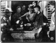 YMCA worker Mrs. F. T. Fitzgerald serving hot chocolate in Bouillonville