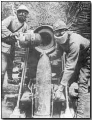 French gun crew wearing gas gear