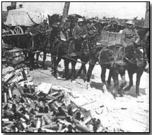 Canadian transport passing piles of spent shell casings at Vimy Ridge
