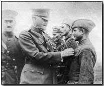 Private Nick Connors, US 42nd Division, receiving DSC from Pershing