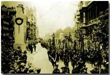 Troops march past temporary Cenotaph June 19th 1919