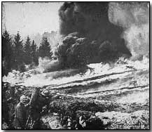 French soldiers make a gas and flame attack on German trenches in Flanders.